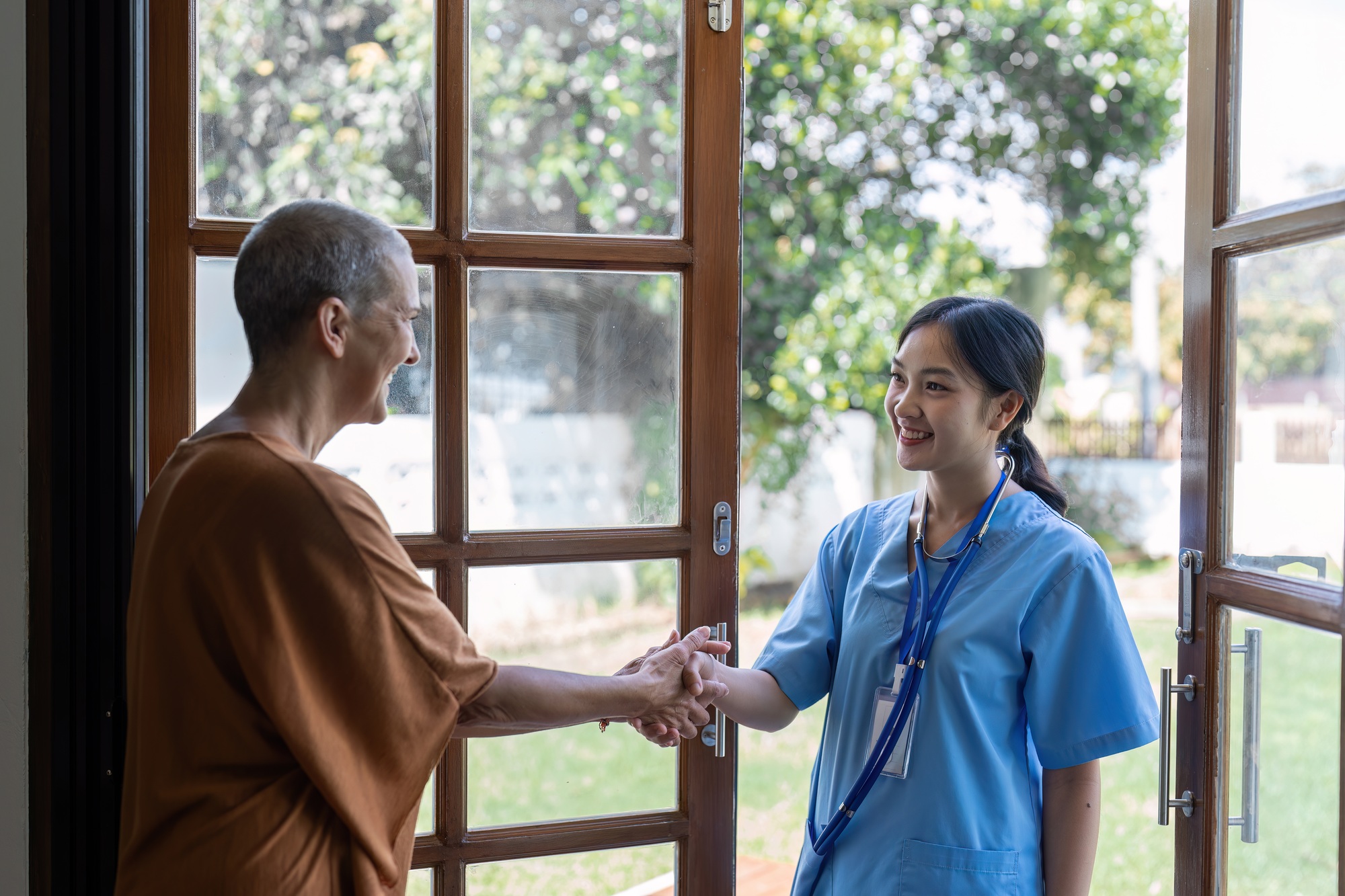 Elderly open door to doctors come for annual home health check-ups based on home health visit